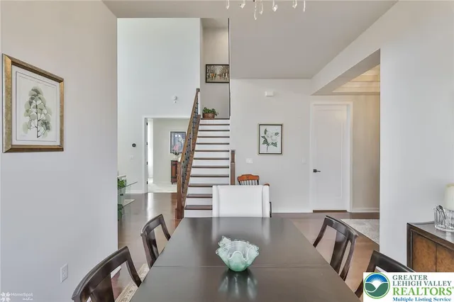 a living room with furniture kitchen view and a fireplace