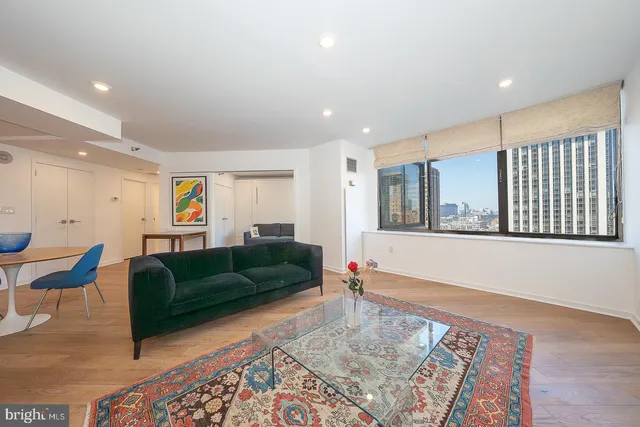 a living room with furniture and a rug