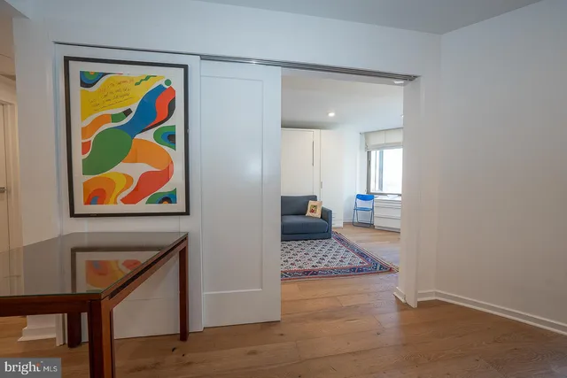 a living room with a couch and a dresser