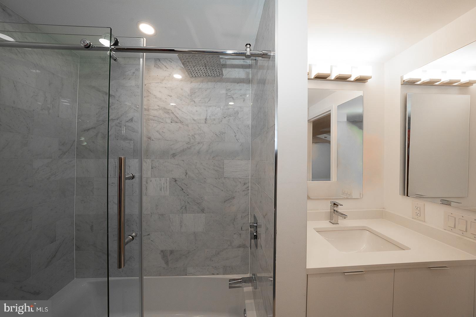 202-10 West Rittenhouse Square, Unit 1205 Philadelphia, PA 19103 - Photo 17 of 28 a bathroom with a shower and a sink