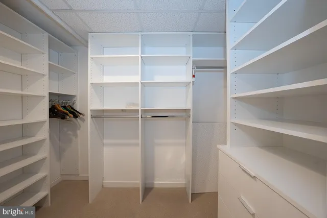 a bathroom with a shower sink and mirror