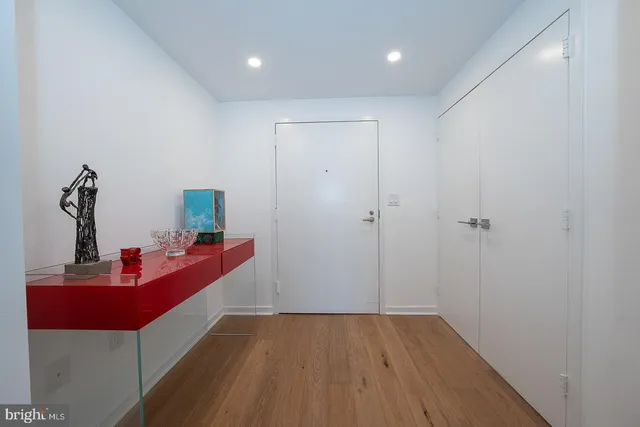 a room with wooden floor and furniture