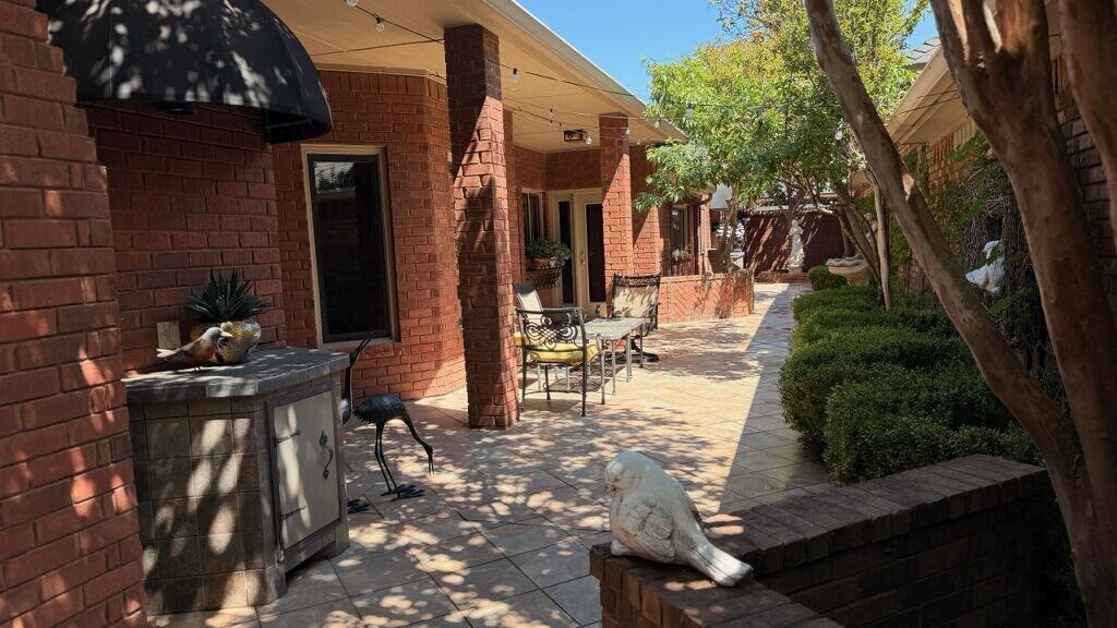 4226 97th Place Lubbock, TX 79423 - Photo 48 of 52 a view of a chairs and tables in the patio