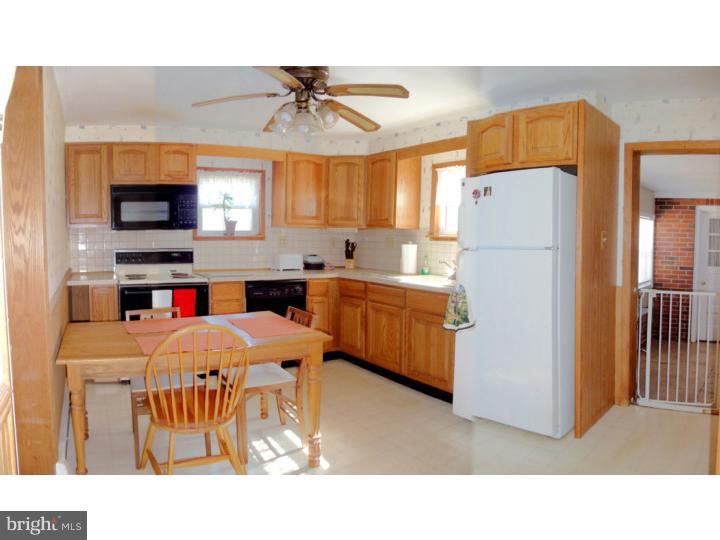 102 Shearers Road Reading, PA 19608 - Photo 5 of 21 a open kitchen with stainless steel appliances kitchen island a refrigerator sink and cabinets