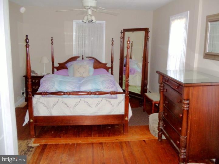 102 Shearers Road Reading, PA 19608 - Photo 9 of 21 a bedroom with a bed and a flat tv screen on dresser