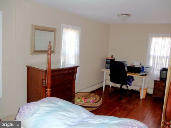 102 Shearers Road Reading, PA 19608 - Photo 10 of 21 a bedroom with a bed and a desk in it