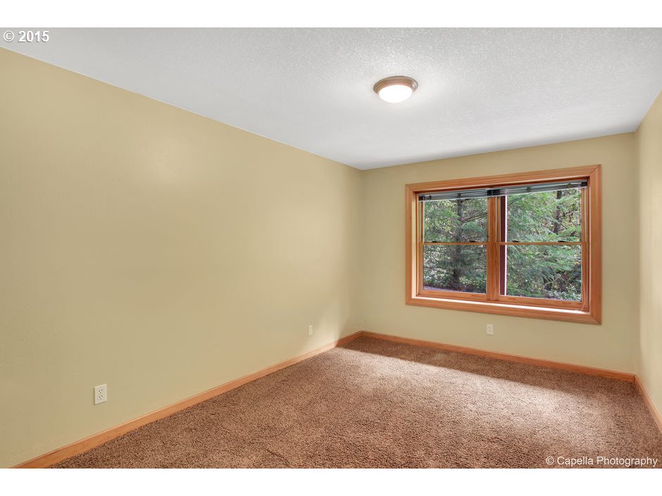 14726 Northwest Newberry Road Portland, OR 97231 - Photo 20 of 28 a view of an empty room with a window