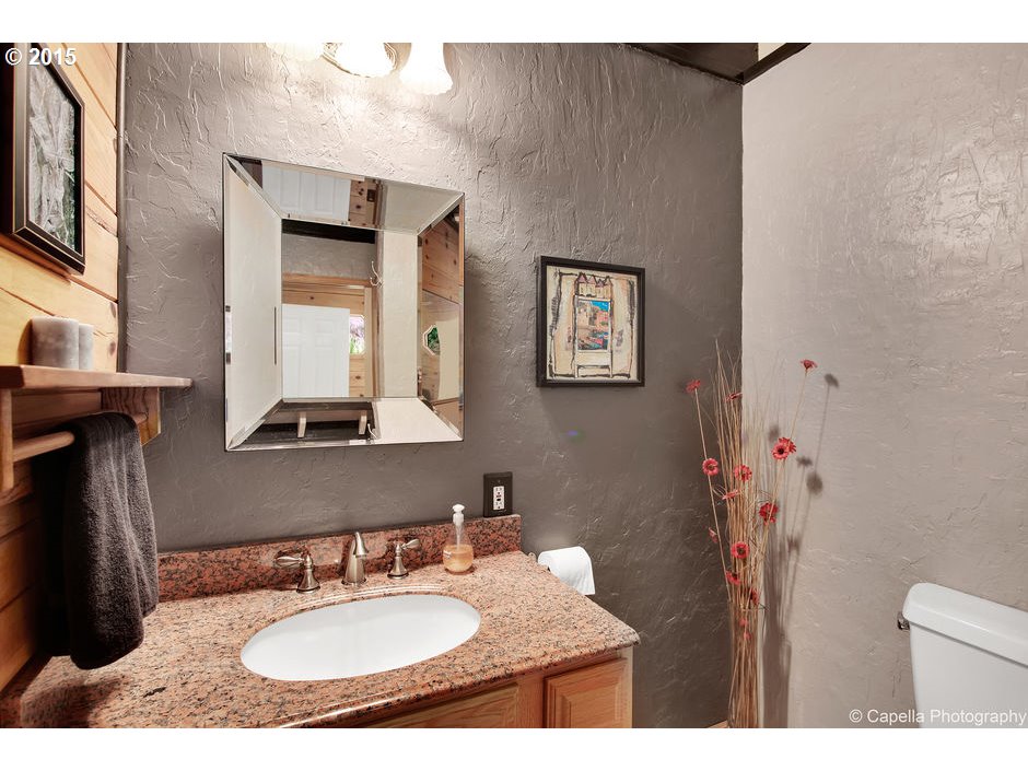 14726 Northwest Newberry Road Portland, OR 97231 - Photo 21 of 28 a bathroom with a sink and a mirror