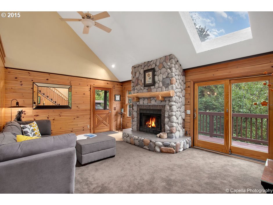 14726 Northwest Newberry Road Portland, OR 97231 - Photo 6 of 28 a living room with furniture and a fireplace