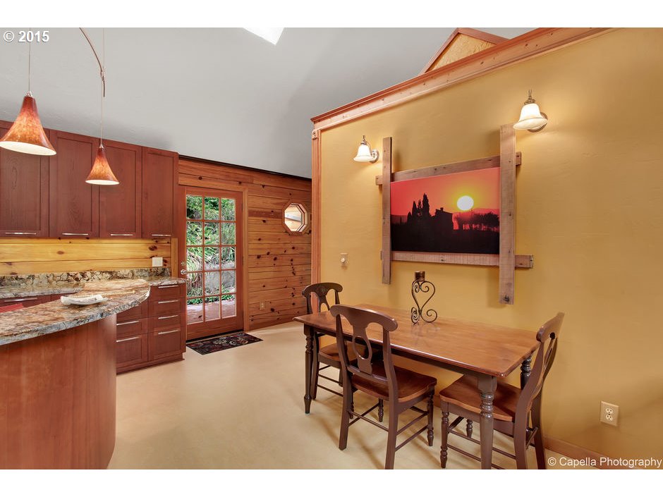 14726 Northwest Newberry Road Portland, OR 97231 - Photo 8 of 28 a view of a dining room with furniture and wooden floor