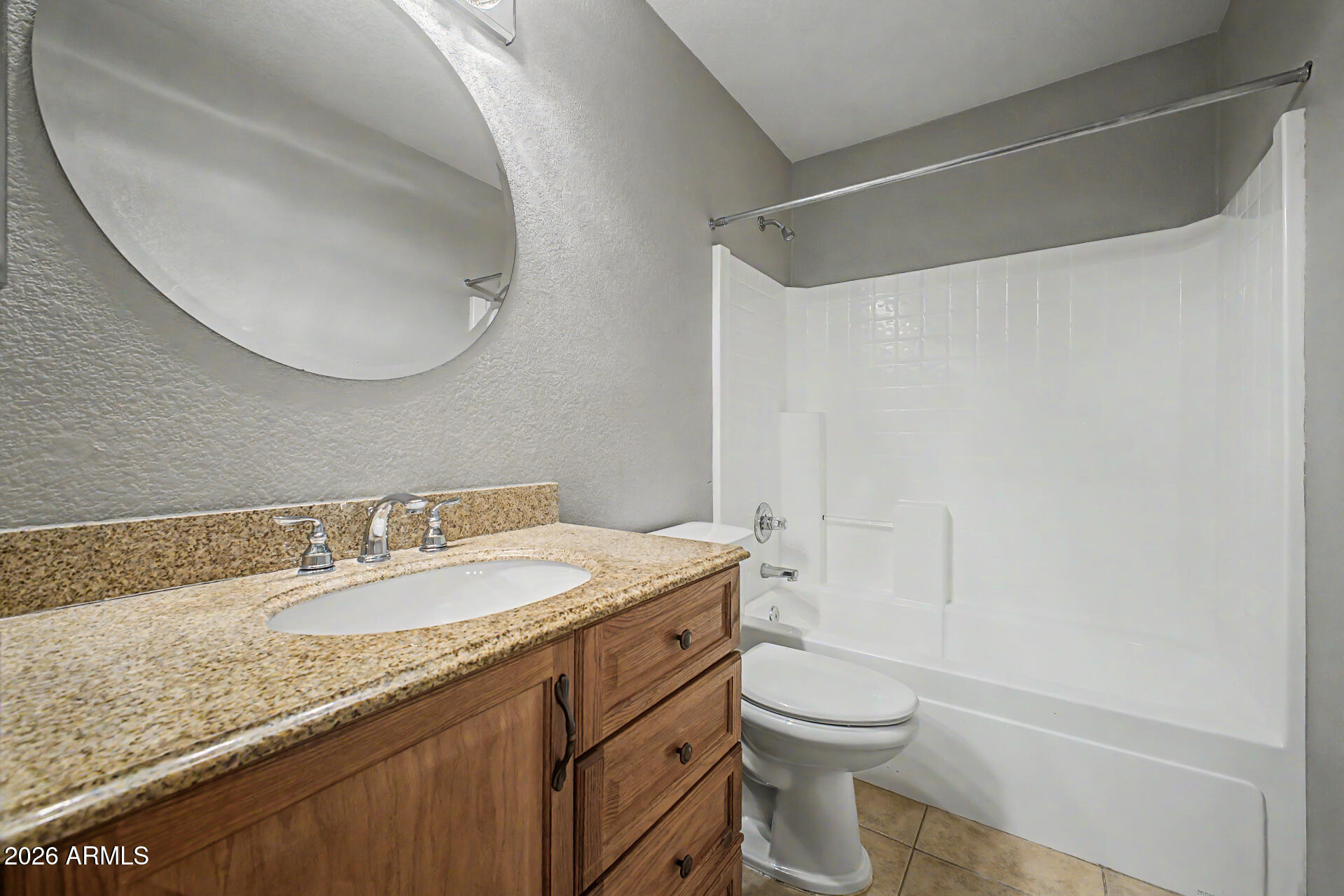 3489 South Bowman Road Apache Junction, AZ 85119 - Photo 7 of 24 a bathroom with a granite countertop sink toilet mirror vanity and shower