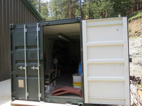 a view of walk in closet with clothes