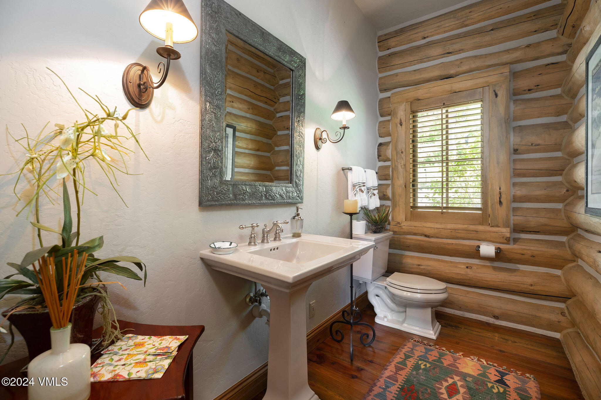 57 Travis Road Wolcott, CO 81655 - Photo 17 of 26 a bathroom with a toilet sink and mirror