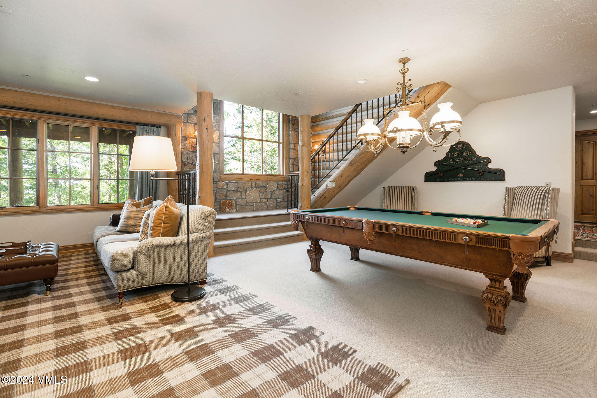 57 Travis Road Wolcott, CO 81655 - Photo 21 of 26 a living room with furniture and a chandelier