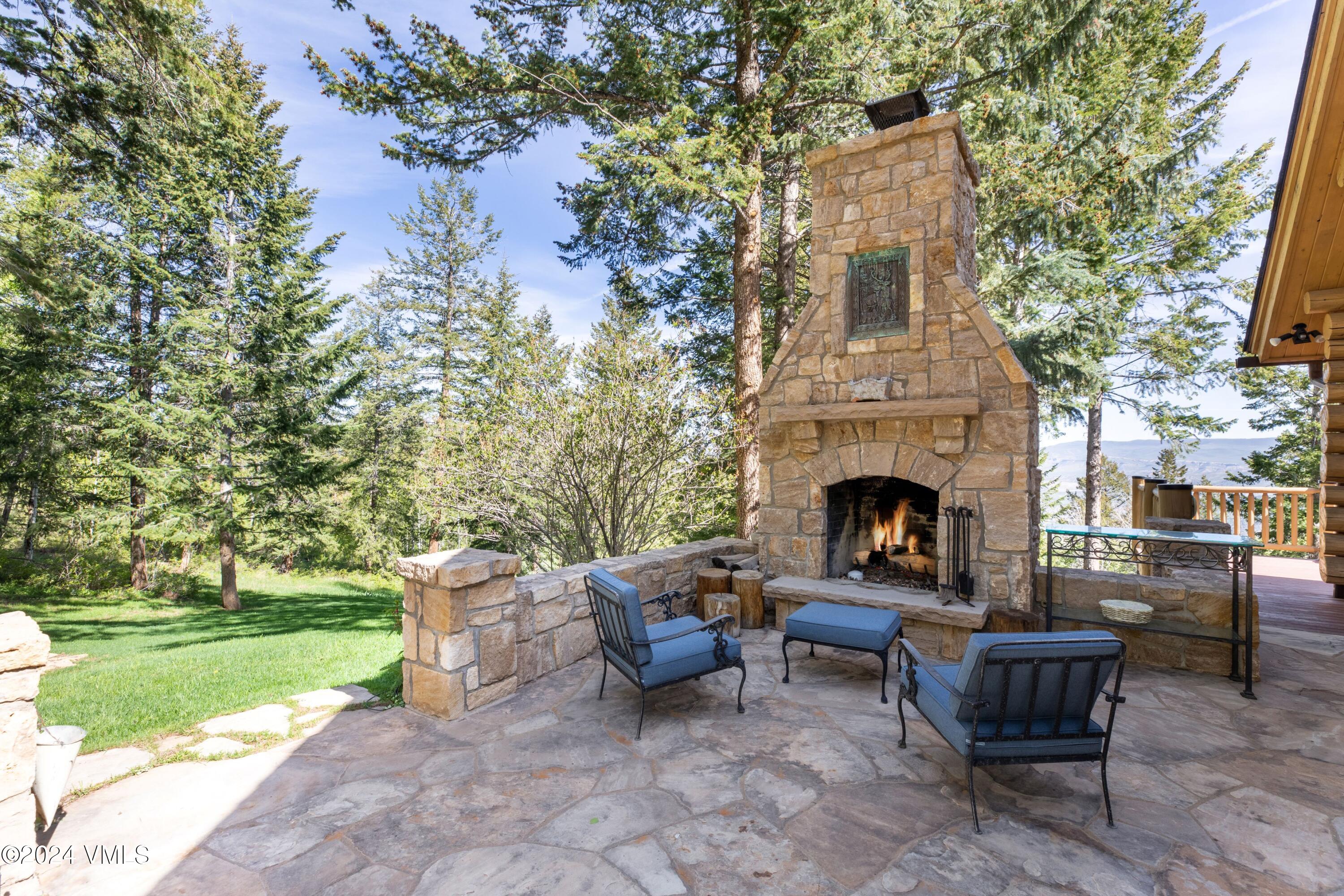 57 Travis Road Wolcott, CO 81655 - Photo 3 of 26 a view of a patio with chairs and a fire pit