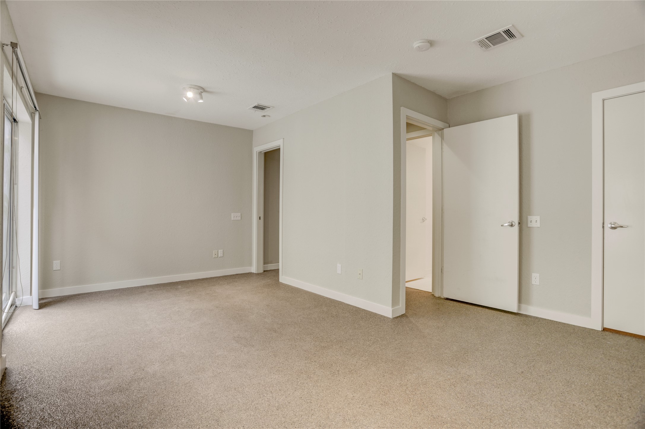 910 Ruthven Street Houston, TX 77019 - Photo 14 of 35 Another view of the opened up L-shaped first floor bedroom