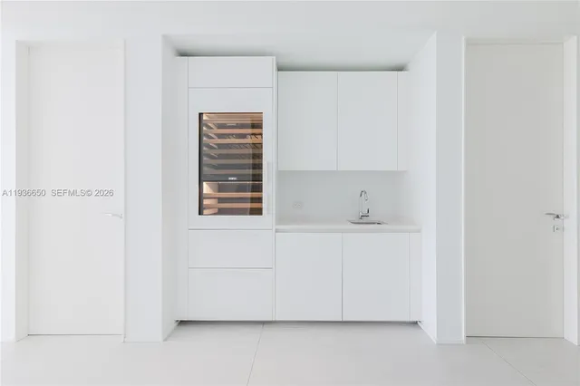 a bathroom with a sink and a window