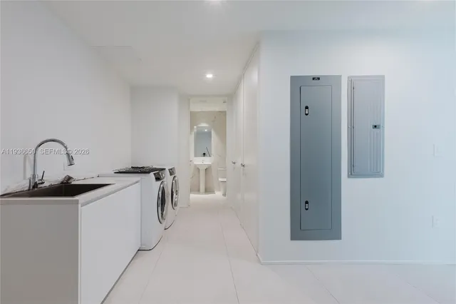 a view of a kitchen with a sink and cabinets