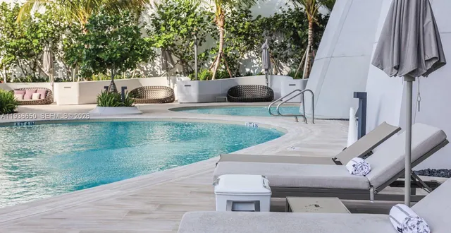 a house view with a sitting space and garden space