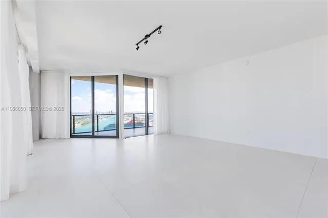 an empty room with windows and view