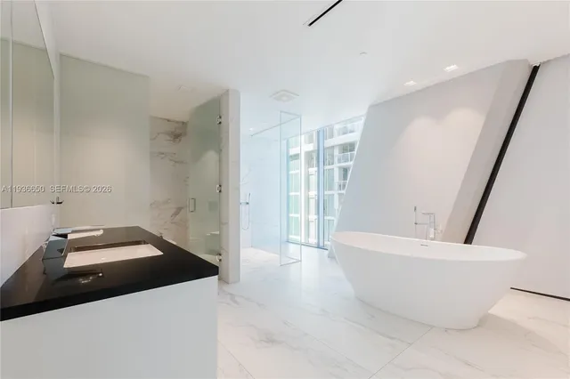 a white bath tub sitting in a bathroom