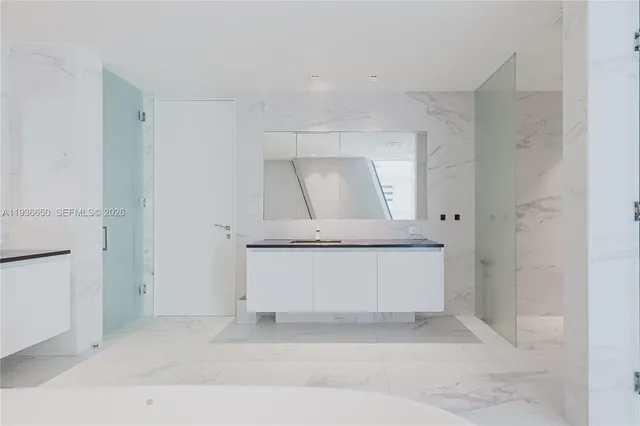 a utility room with a sink dryer and washer