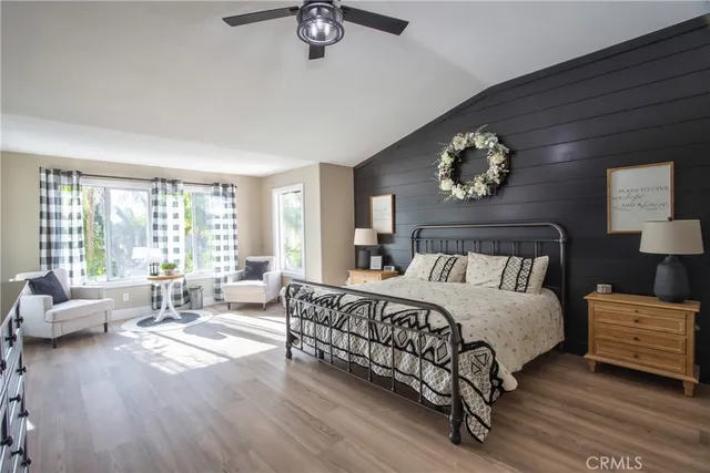 a bathroom with a sink a large mirror and a shower