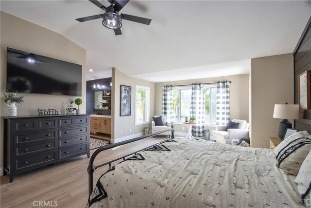 a spacious bathroom with a double vanity sink a mirror and a bathtub
