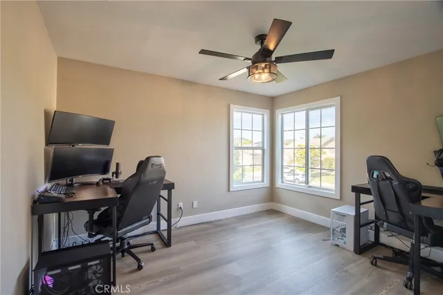a view of backyard with swimming pool and outdoor seating