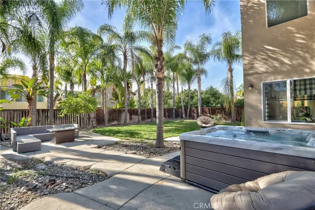an aerial view of residential houses with outdoor space and parking