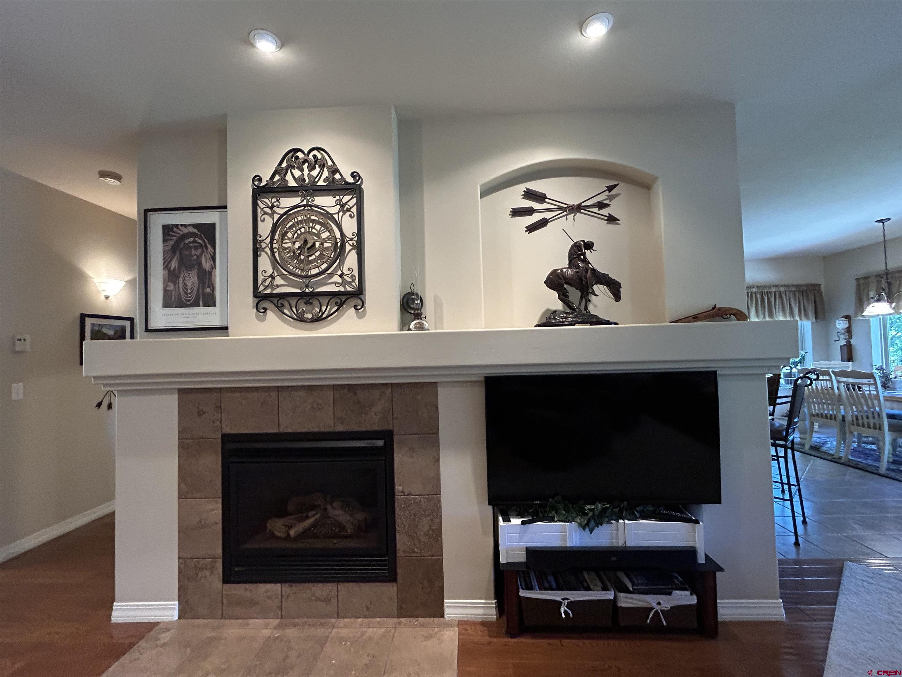 850 Southeast Pinyon Street Cedaredge, CO 81413 - Photo 7 of 45 a living room with furniture and a fireplace
