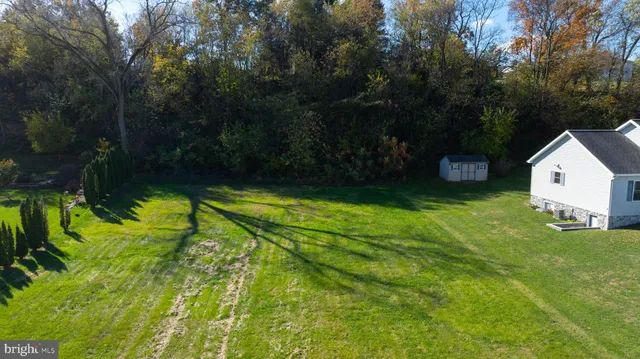 a view of a house with a big yard