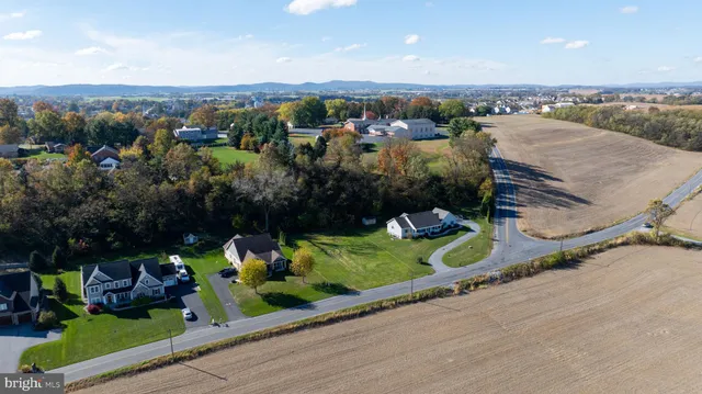 an aerial view of a house with a garden