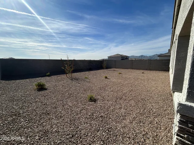 a view of roof with mountain view