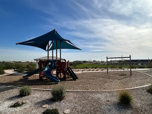 a view of a bike park with large trees