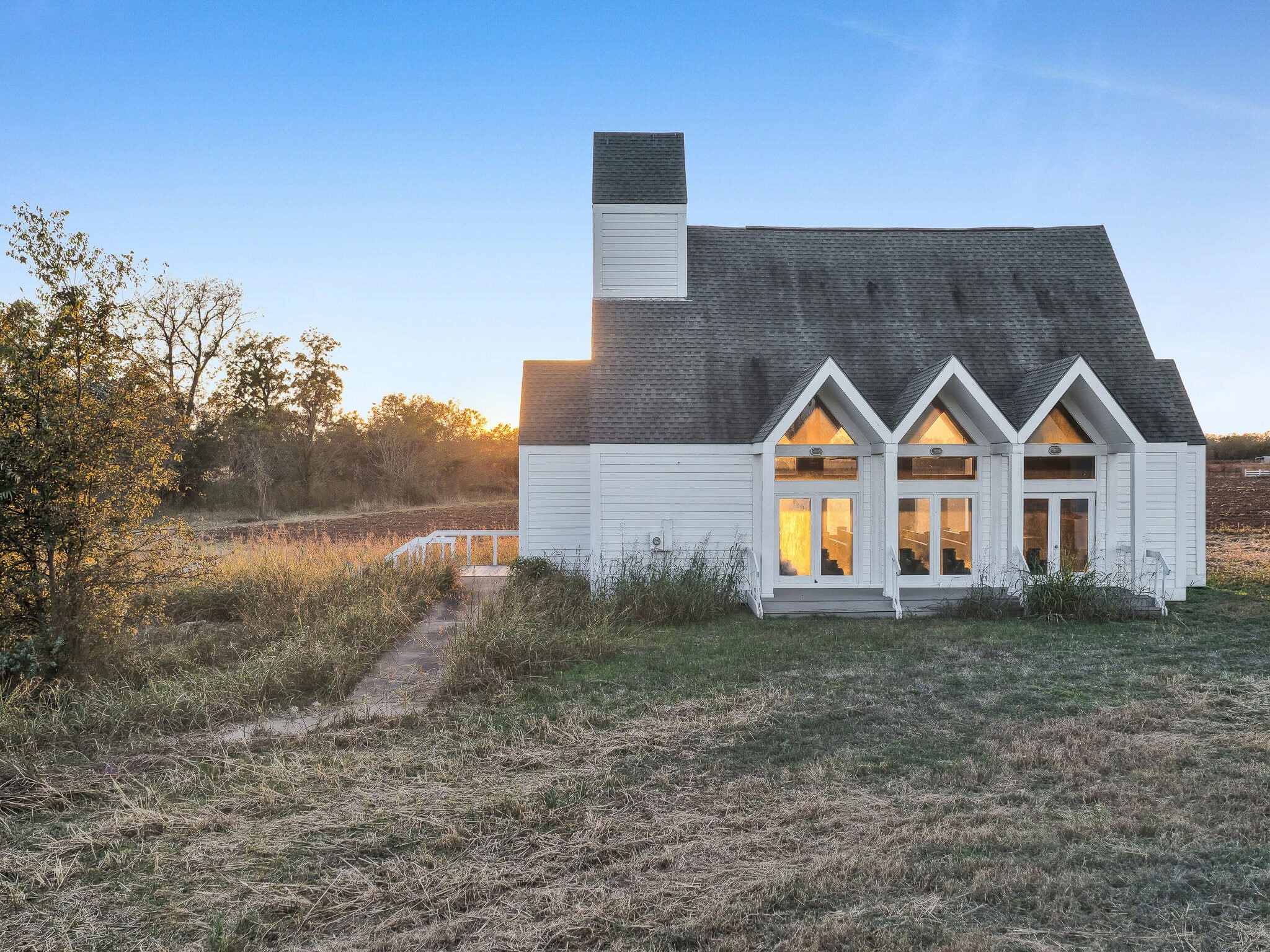 4073 Fm 3318 Road Brookshire, TX 77423 - Photo 48 of 50 a view of a house next to a yard and a large tree