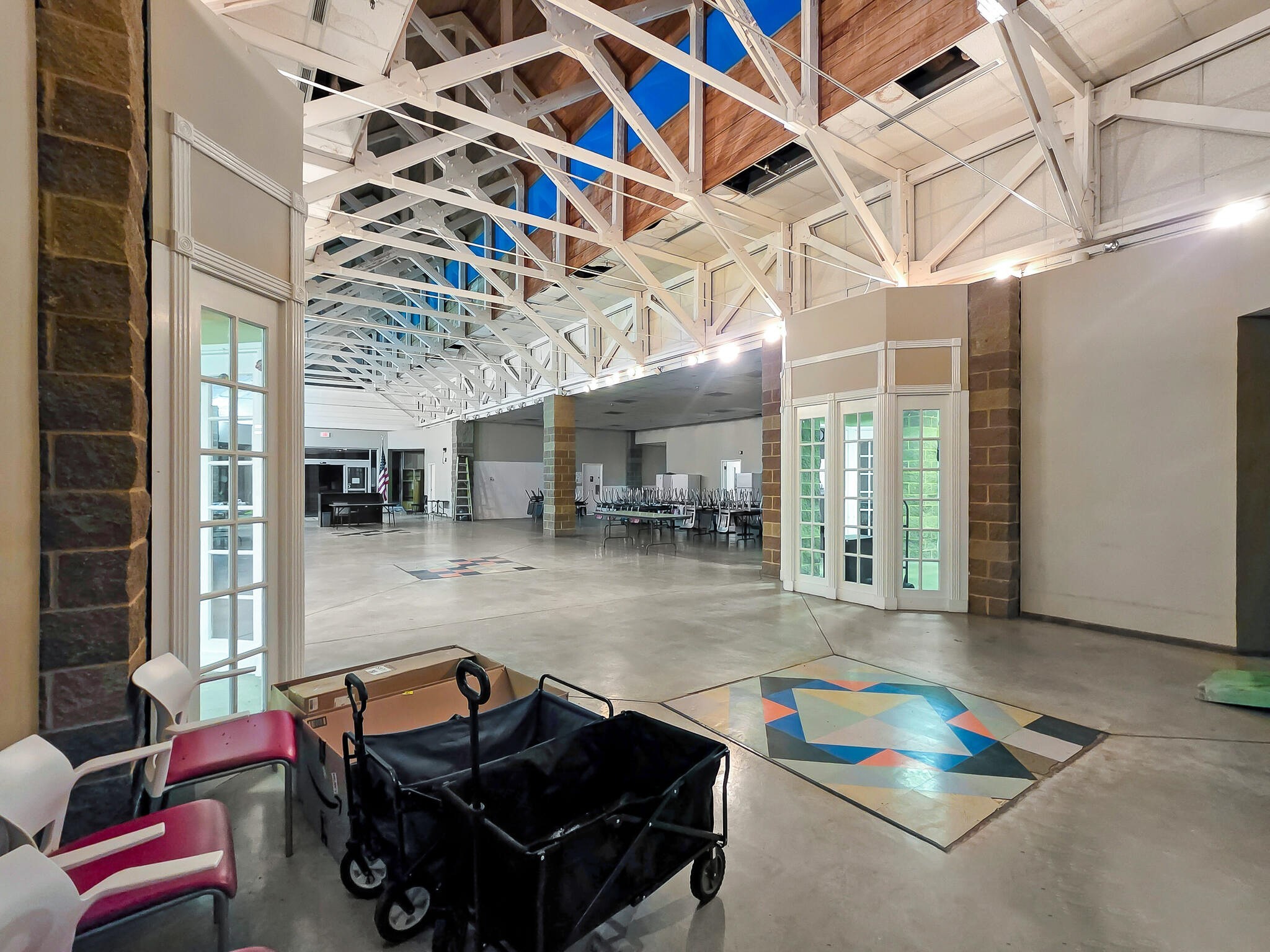 4073 Fm 3318 Road Brookshire, TX 77423 - Photo 10 of 50 a living room with furniture a flat screen tv and a floor to ceiling window