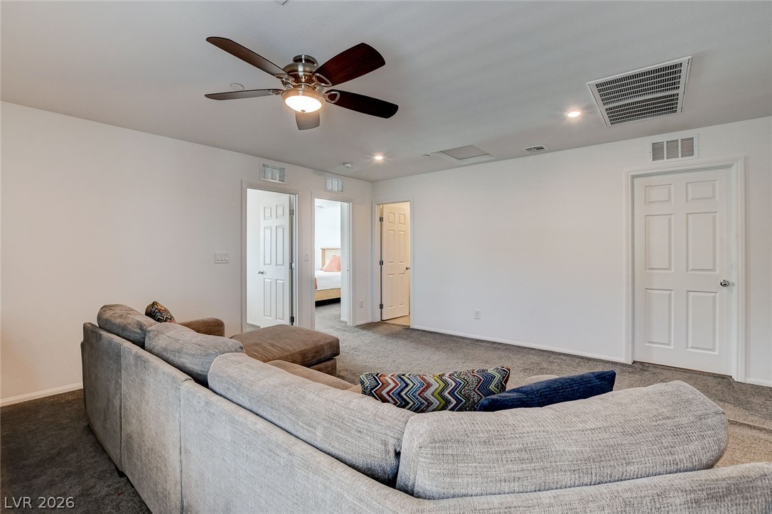 484 Filaree Place Henderson, NV 89015 - Photo 30 of 71 This versatile bonus room offers ample space for various activities, perfect for unwinding or entertaining.
