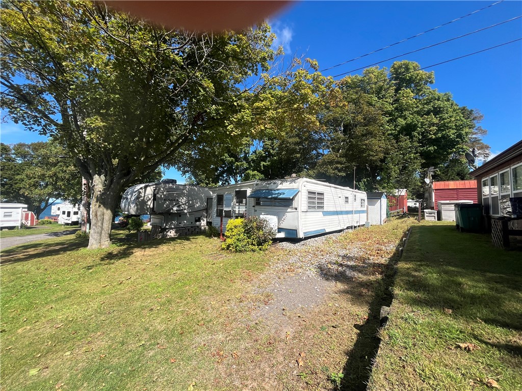 7945 Lake Road, Unit 34 Sodus, NY 14555 - Photo 2 of 24 PARKING AREA BIG ENOUGH FOR TWO VEHICLES!