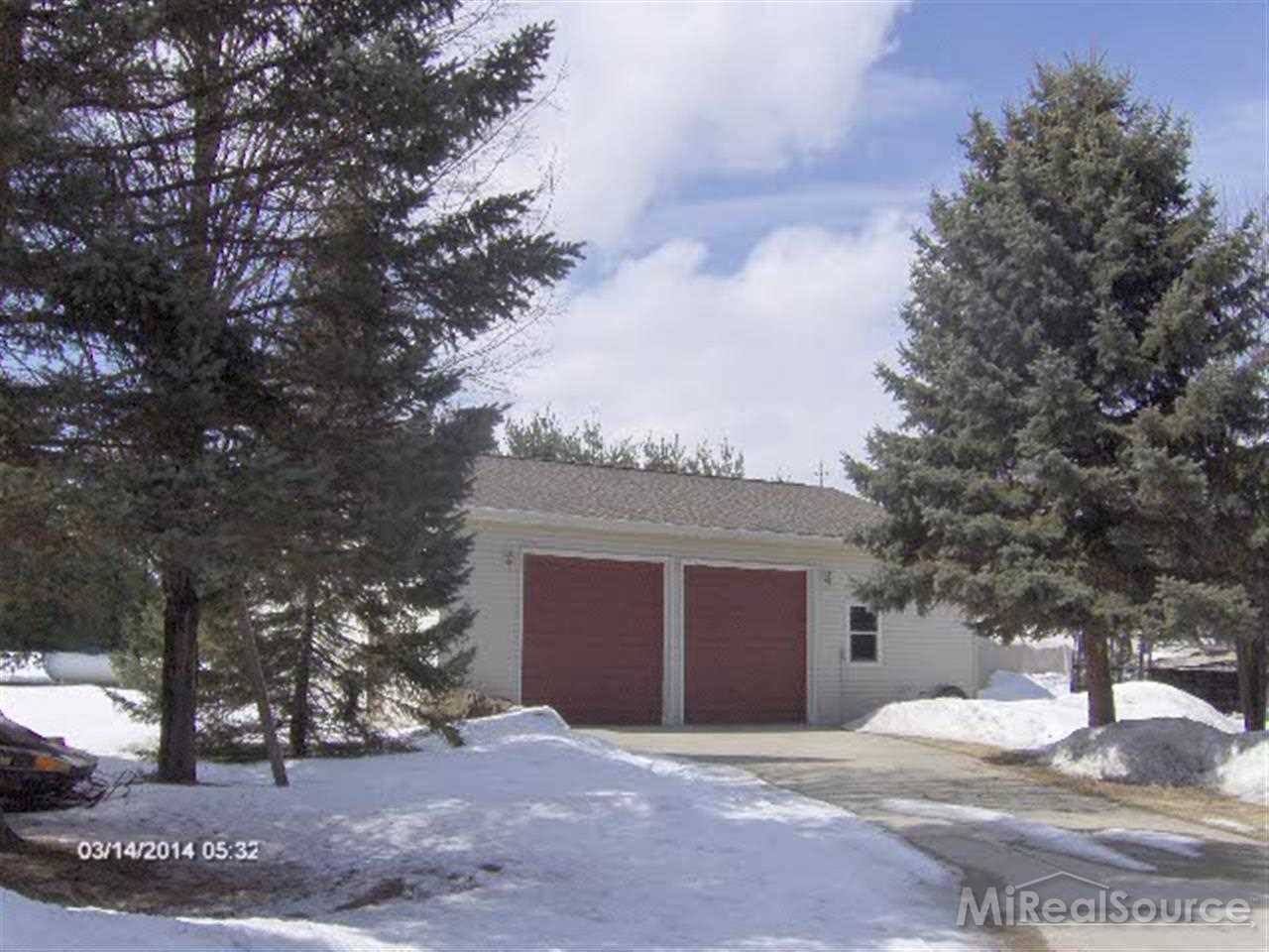 3720 Wills Road Croswell, MI 48422 - Photo 8 of 10 This 41x50 garage has a concrete floor, power, work room, loft, and finished doors.