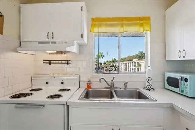 a bathroom with a sink and a window