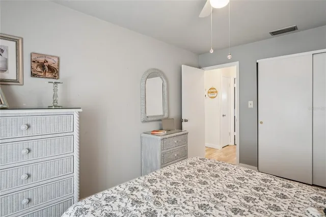 a bedroom with a bed and a dresser in it