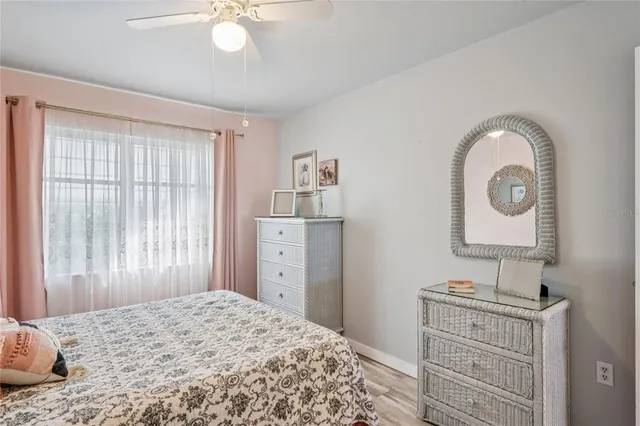 a bedroom with a bed and cabinets