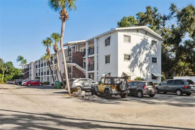 a view of a street with cars