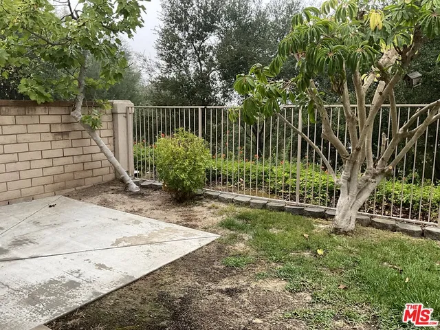 an empty room with wooden floor and a window