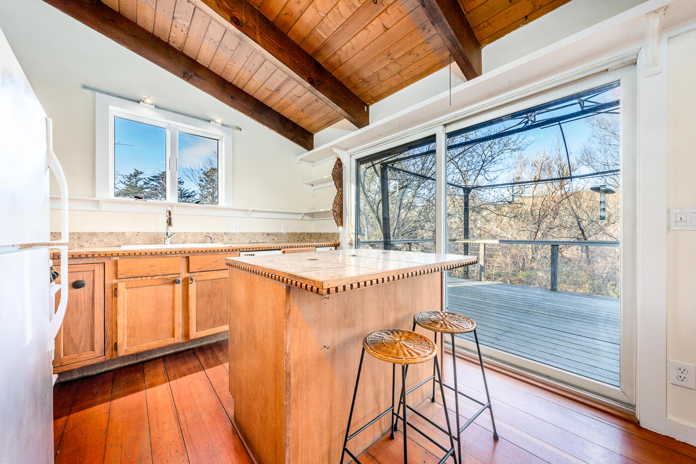 336 Main Street Wellfleet, MA 02667 - Photo 22 of 39 view of a kitchen with a large window and wooden floor