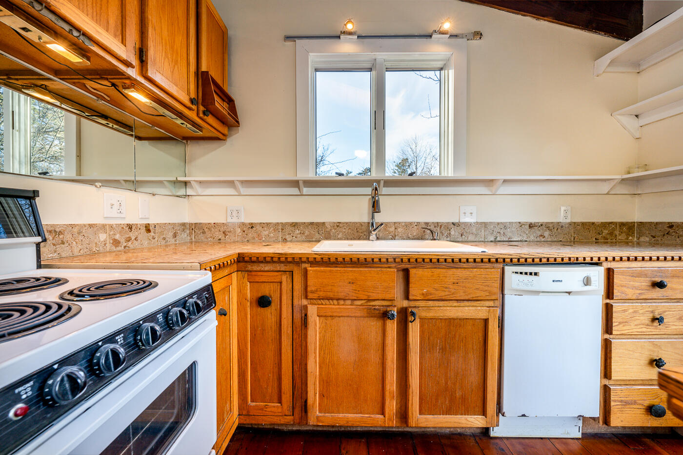 336 Main Street Wellfleet, MA 02667 - Photo 23 of 39 a kitchen with a stove and a cabinet