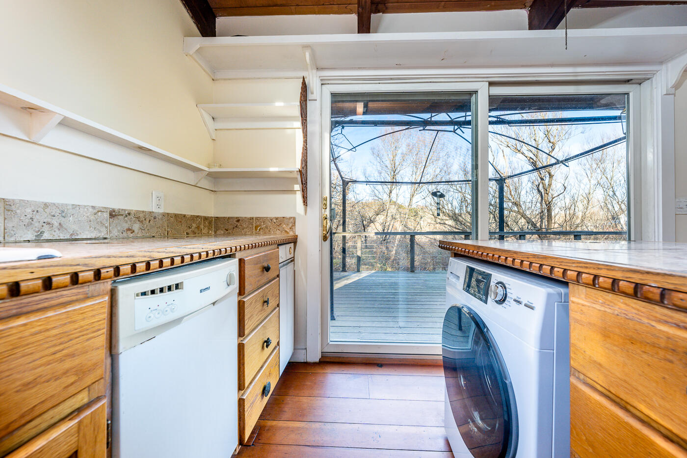 336 Main Street Wellfleet, MA 02667 - Photo 24 of 39 a view of a kitchen with a sink and wooden floor