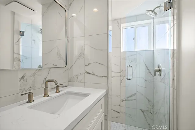 a view of a bedroom with furniture and windows