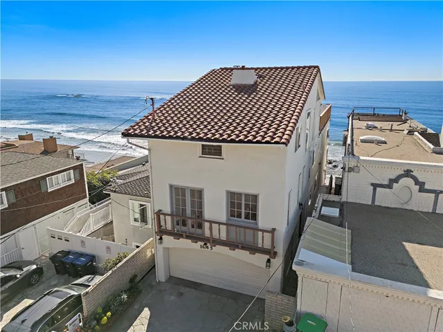 a view of a house with a wooden deck